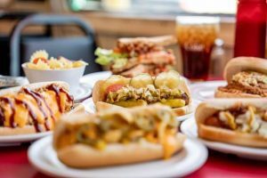 Burgers and hotdogs on a table