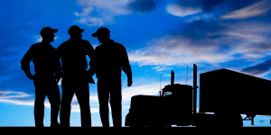 People in front of truck